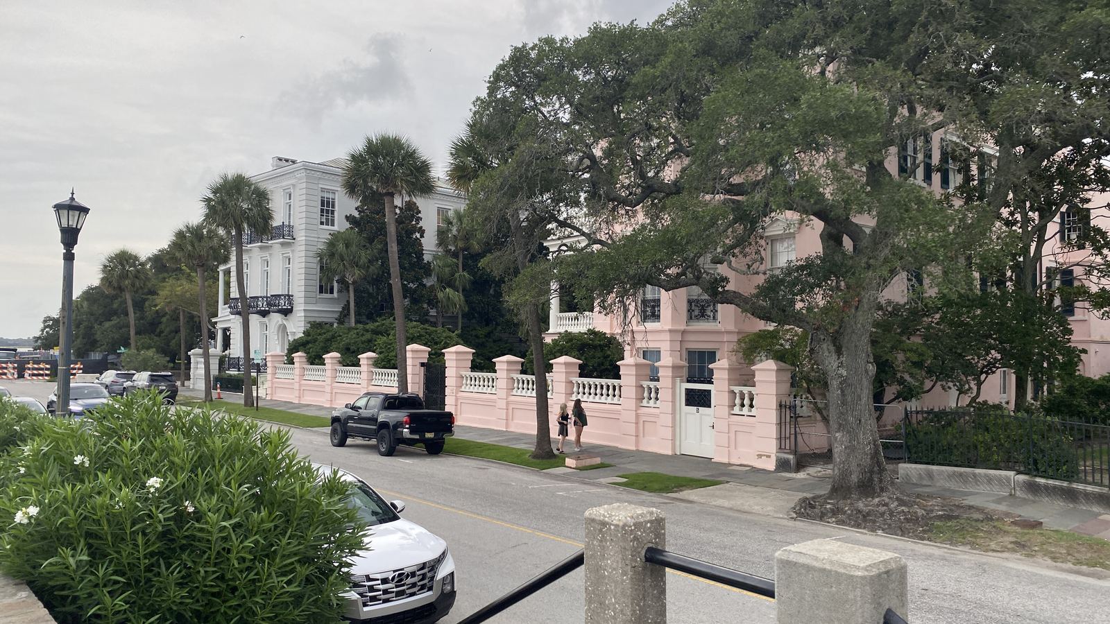 Historic mansions and live oaks along the Battery in Charleston on a summer day