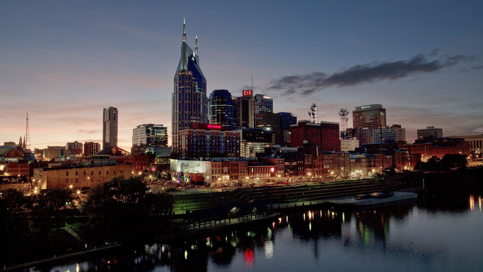 The Nashville skyline at dusk reflected in the Cumberland River